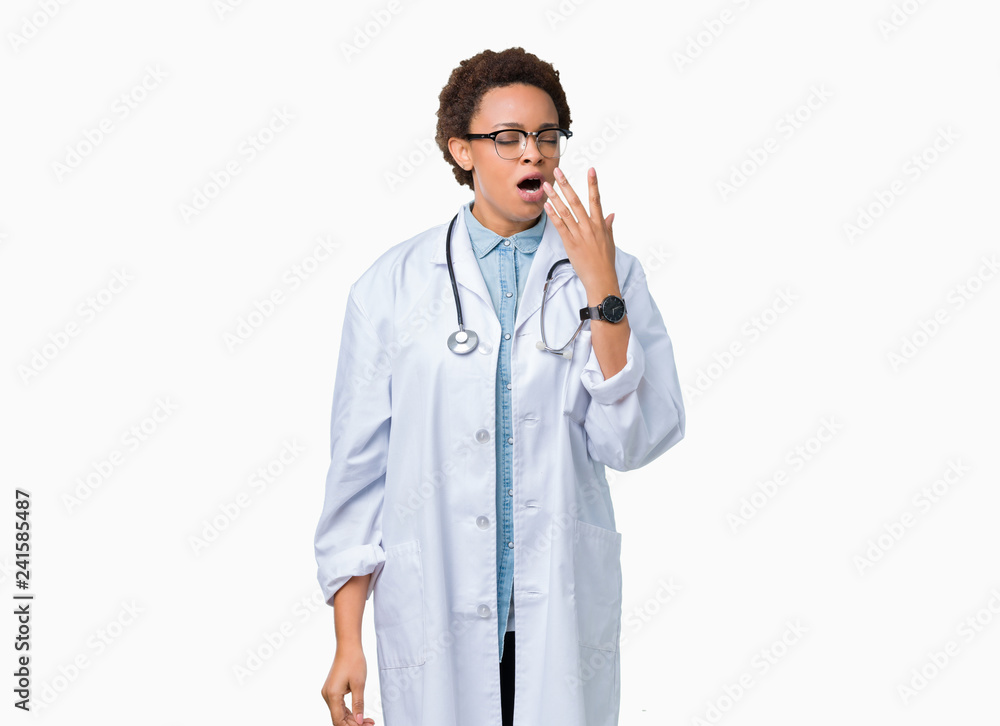 Young african american doctor woman wearing medical coat over isolated background bored yawning tired covering mouth with hand. Restless and sleepiness. Young african american doctor woman wearing medical coat over isolated background bored yawning tired covering mouth with hand. Restless and sleepiness.