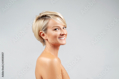 Face skin care. Beautiful woman with clean fresh skin and naked shoulders.