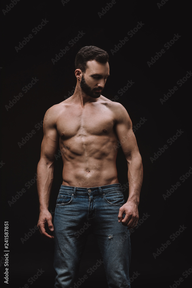 Fototapeta premium sexy shirtless man posing isolated on black