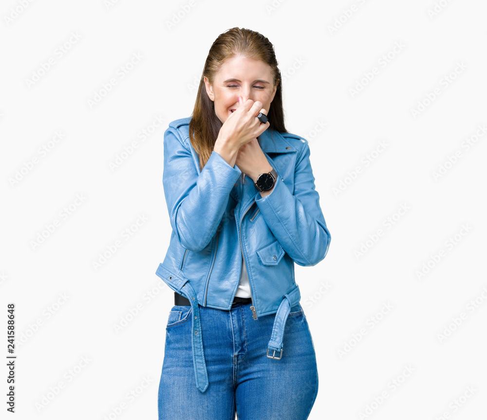 Beautiful middle age mature woman wearing fashion leather jacket over isolated background smelling something stinky and disgusting, intolerable smell, holding breath with fingers on nose Beautiful middle age mature woman wearing fashion leather jacket over isolated background smelling something stinky and disgusting, intolerable smell, holding breath with fingers on nose