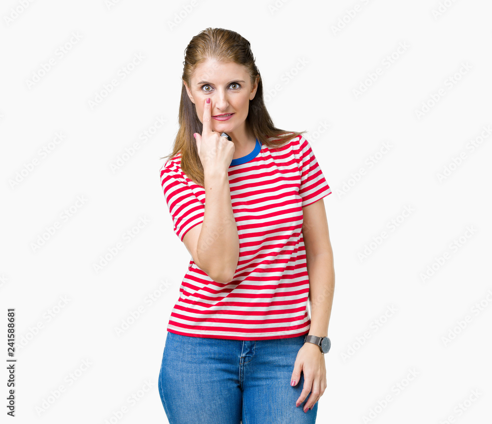 Middle age mature woman wearing casual t-shirt over isolated background Pointing to the eye watching you gesture, suspicious expression Middle age mature woman wearing casual t-shirt over isolated background Pointing to the eye watching you gesture, suspicious expression