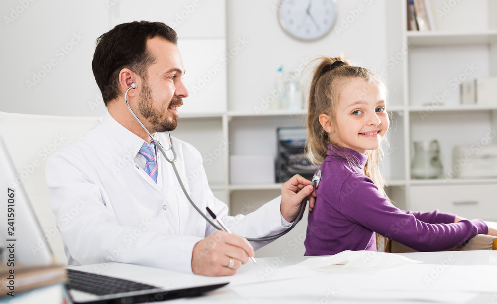 Male doctor and little girl