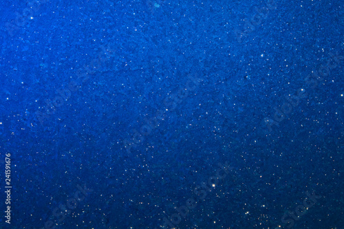 Blue graduated background with star effect