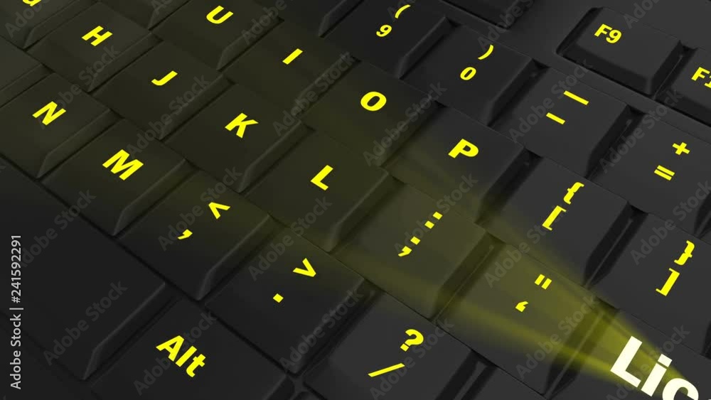 pointing the camera on yellow glowing License key on black computer keyboard pointing the camera on yellow glowing License key on black computer keyboard