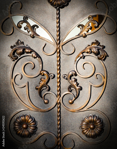 Forged items on gray metal gates