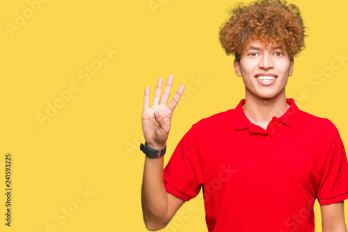 Young handsome man with afro hair wearing red t-shirt showing and pointing up with fingers number four while smiling confident and happy.