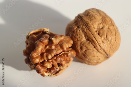 Shelled walnuts and walnut kernels. Stock Photo. photo