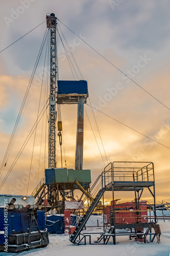 Wallpaper Mural Drilling a deep well with a drilling rig in an oil and gas field. The field is located in the Far North beyond the Arctic Circle. Beautiful dramatic sky of the polar day. Torontodigital.ca