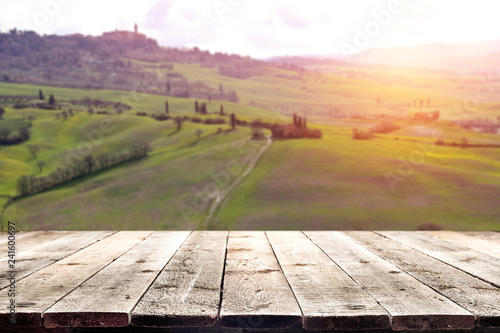A wooden table with space for an advertising product in the spring day of beautiful Tuscany    © magdal3na