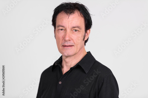 Face of mature handsome man against white background