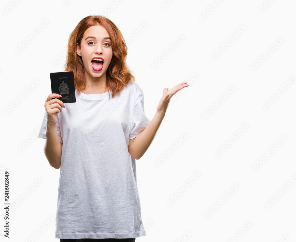 Young beautiful woman holding passport of canada over isolated background very happy and excited, winner expression celebrating victory screaming with big smile and raised hands Young beautiful woman holding passport of canada over isolated background very happy and excited, winner expression celebrating victory screaming with big smile and raised hands