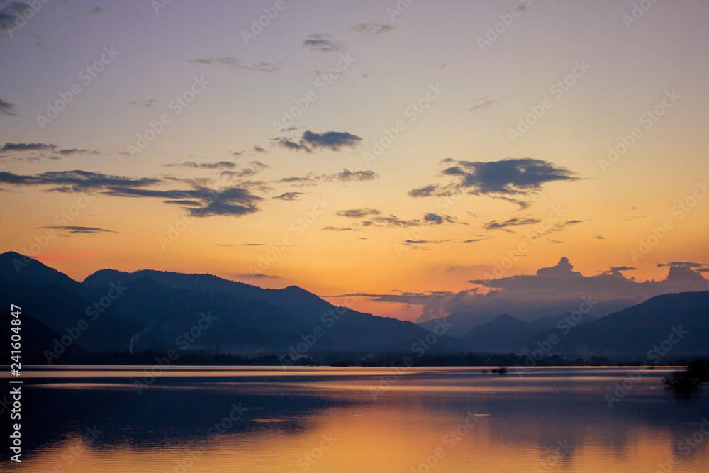 Beautiful Landscape of evening lake view that show The reflection of the mountain on the water is so beautiful.