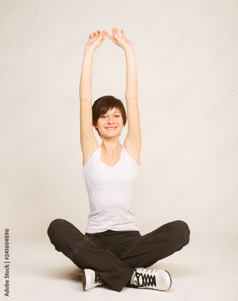 woman doing stretching exercise at the gym woman doing stretching exercise at the gym