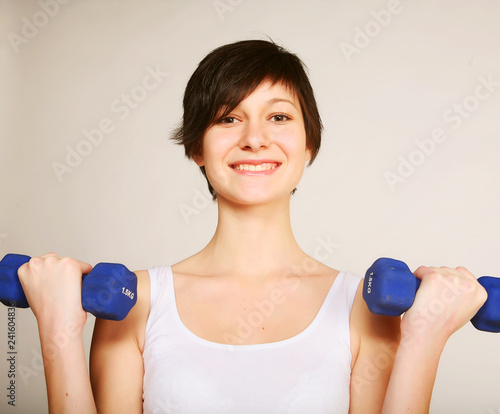 fitness woman lifting weights  photo