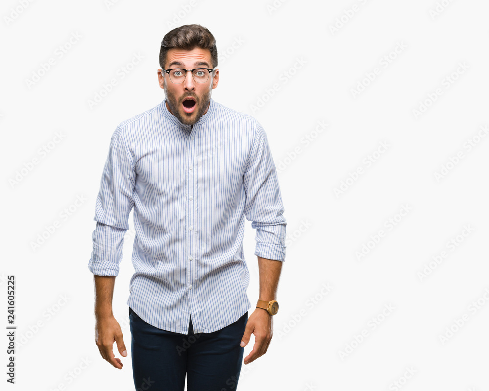 Young handsome man over isolated background afraid and shocked with surprise expression, fear and excited face. Young handsome man over isolated background afraid and shocked with surprise expression, fear and excited face.