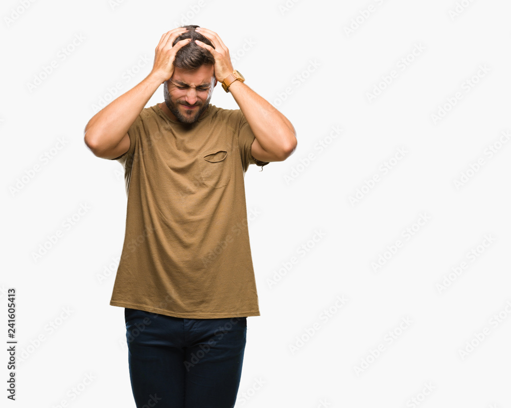 Young handsome man over isolated background suffering from headache desperate and stressed because pain and migraine. Hands on head. Young handsome man over isolated background suffering from headache desperate and stressed because pain and migraine. Hands on head.