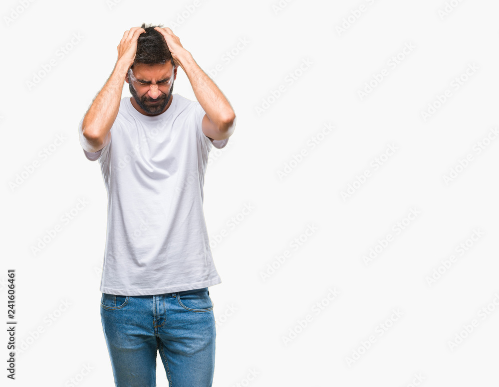 Adult hispanic man over isolated background suffering from headache desperate and stressed because pain and migraine. Hands on head. Adult hispanic man over isolated background suffering from headache desperate and stressed because pain and migraine. Hands on head.
