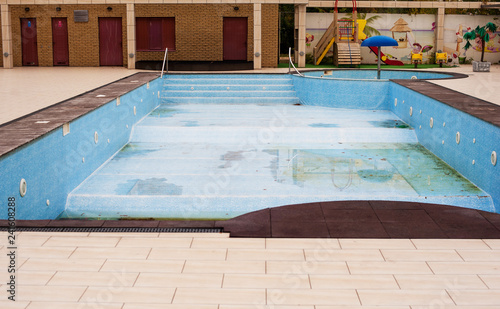 Empty outdoor swimming pool with children area