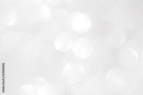 A brilliant blurry white background for a festive mood. Template for greeting card for entertainment.