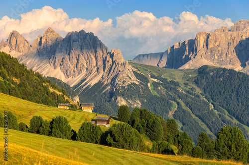 Traditional huts with Cir Group and Sella group in the background, Ortisei, Gardena Valley, South Tyrol, Dolomites photo