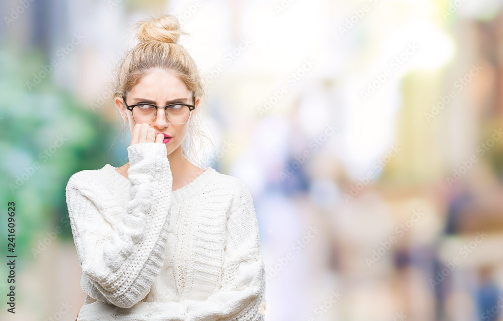 Young beautiful blonde woman wearing glasses over isolated background looking stressed and nervous with hands on mouth biting nails. Anxiety problem. Young beautiful blonde woman wearing glasses over isolated background looking stressed and nervous with hands on mouth biting nails. Anxiety problem.