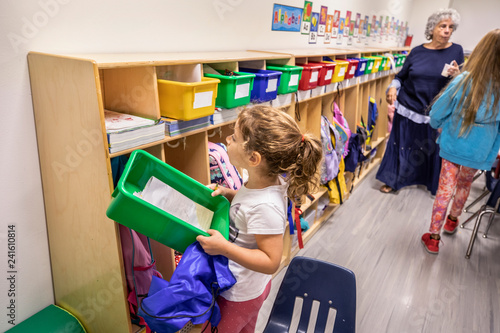 Young girl holding a box 