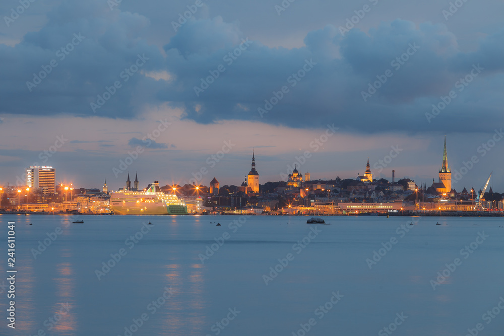 Beautiful waterfront of old Tallinn and harbor at night