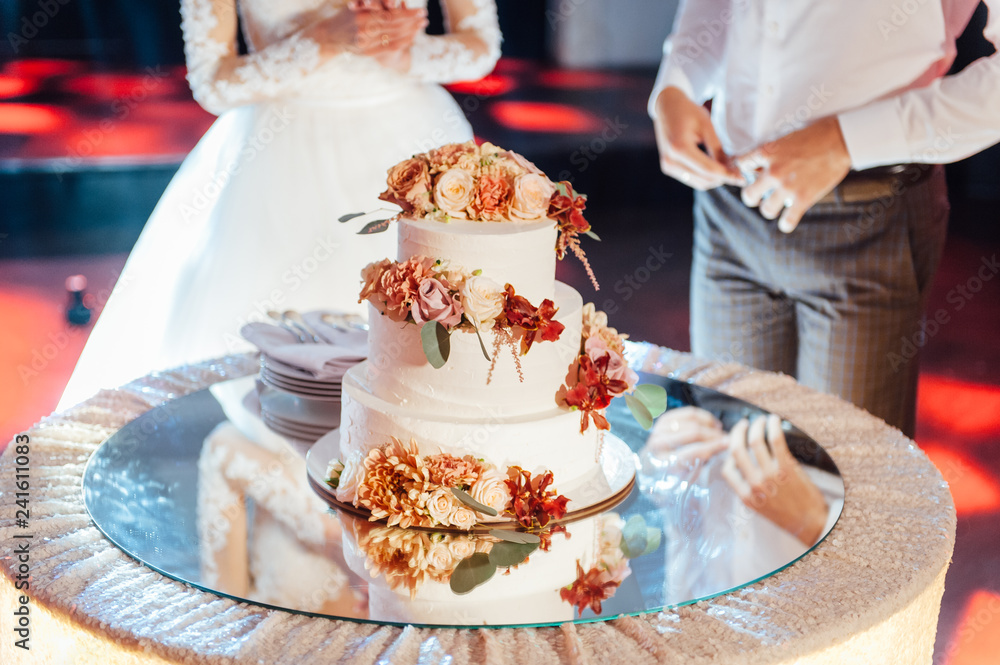 Beautiful delicious white wedding cake. Wedding day