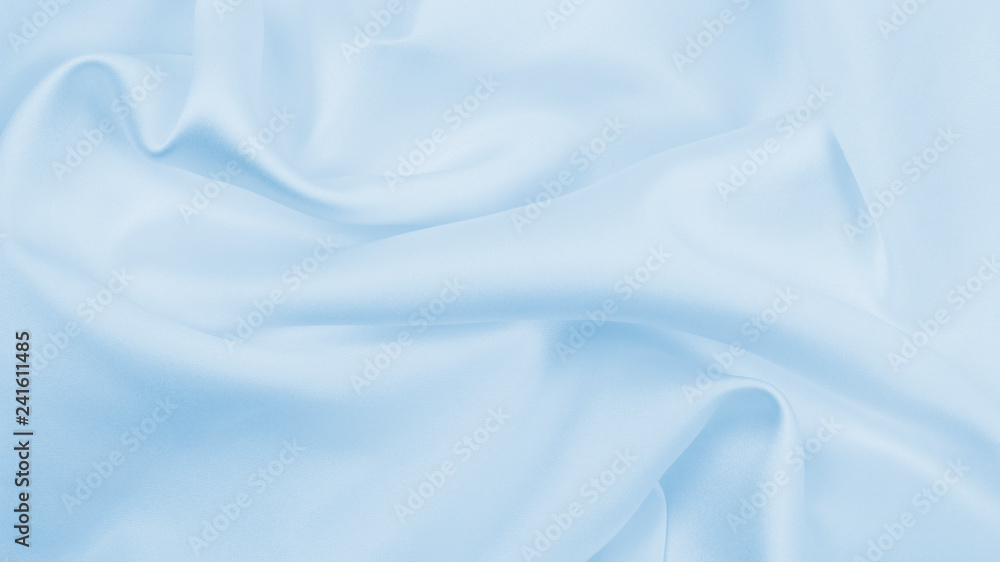 Obraz premium Smooth elegant blue silk or satin luxury cloth texture as abstract background. Luxurious background design