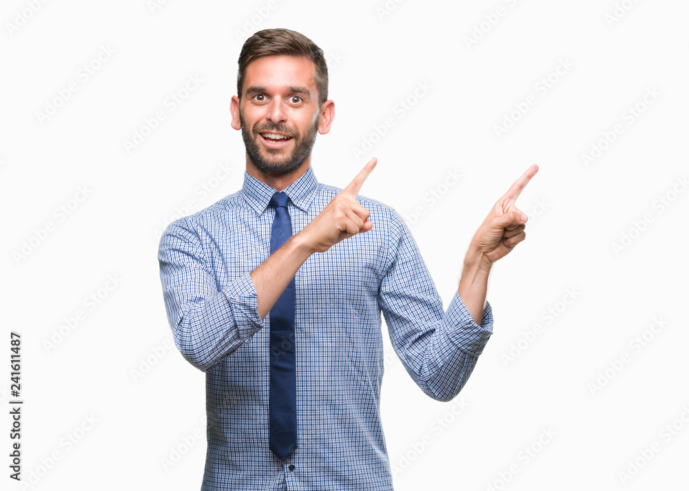 Young handsome business man over isolated background smiling and looking at the camera pointing with two hands and fingers to the side. Young handsome business man over isolated background smiling and looking at the camera pointing with two hands and fingers to the side.