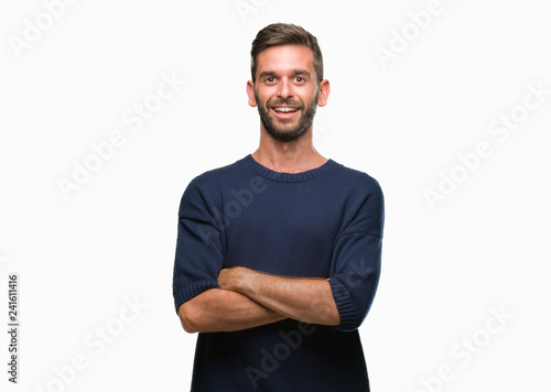 Young handsome man wearing winter sweater over isolated background happy face smiling with crossed arms looking at the camera. Positive person.