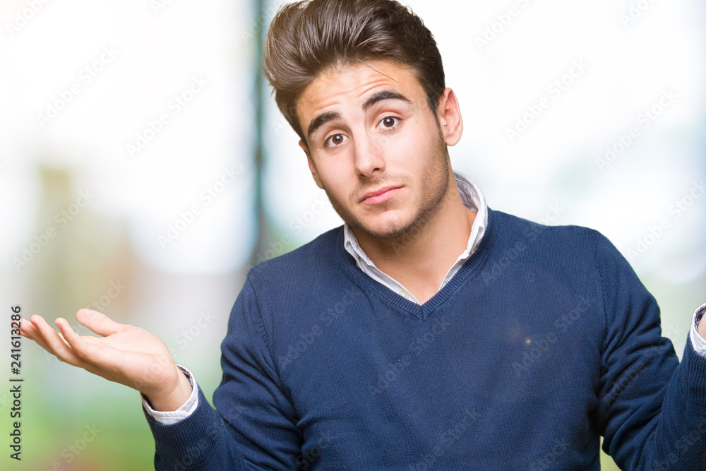 Young handsome business man over isolated background clueless and confused expression with arms and hands raised. Doubt concept. Young handsome business man over isolated background clueless and confused expression with arms and hands raised. Doubt concept.