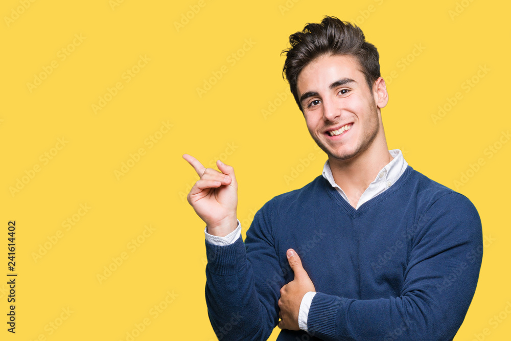 Young handsome business man over isolated background with a big smile on face, pointing with hand and finger to the side looking at the camera. Young handsome business man over isolated background with a big smile on face, pointing with hand and finger to the side looking at the camera.