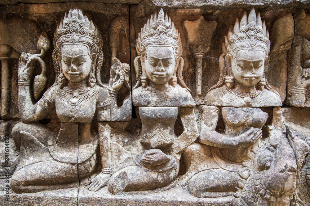 Ancient ruins and bas relief in Siem Reap Park, Cambodia