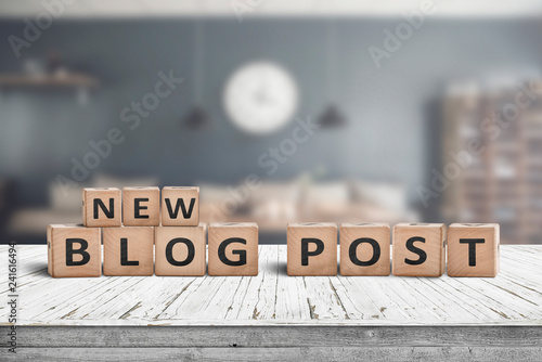 New blog post sign on a wooden desk photo