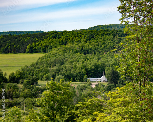 rural scene of country church surrounded by trees