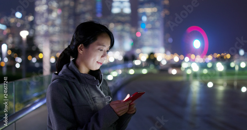 Photography Woman send sms on cellphone at night