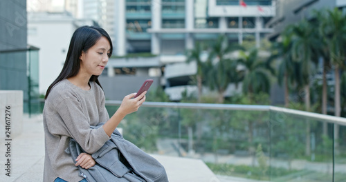 Free Download Woman use of mobile phone in Hong Kong city - GFXLoad