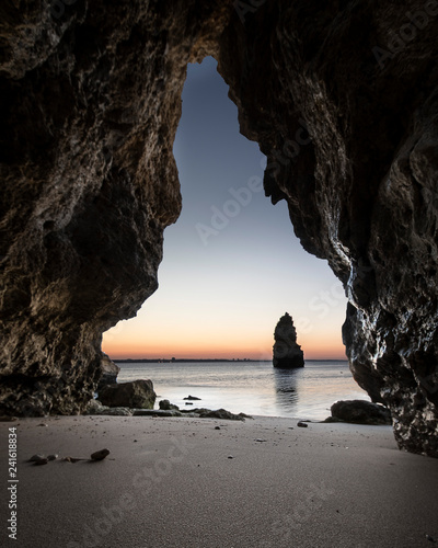 landscape of Portugal , beach and rocks in the sunset
