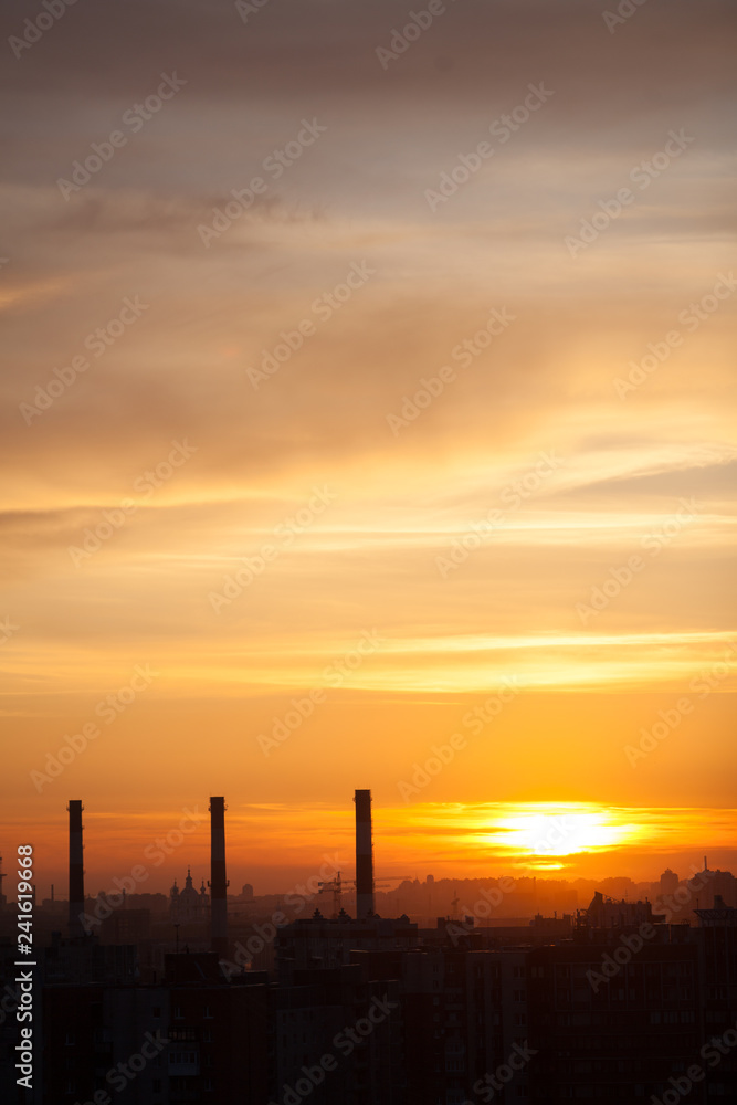 Three chimneys at sunset, city landscape
