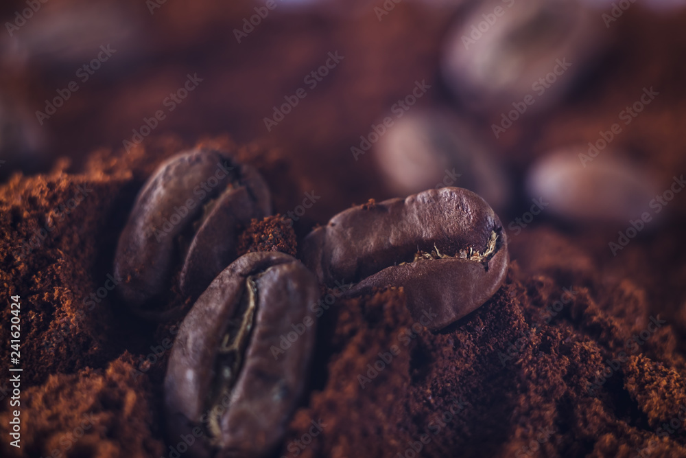 Ground coffee and grains macro shot. Smoke from freshly roasted coffee beans.