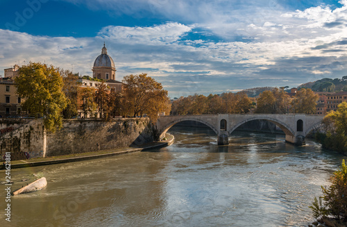 View of Ponte Principe Amedeo Savoia Aosta that spans riber Tiber, with Museo di arte sacra San Giovanni dei Fiorentini in the background. Rome, Italy, December 2018.