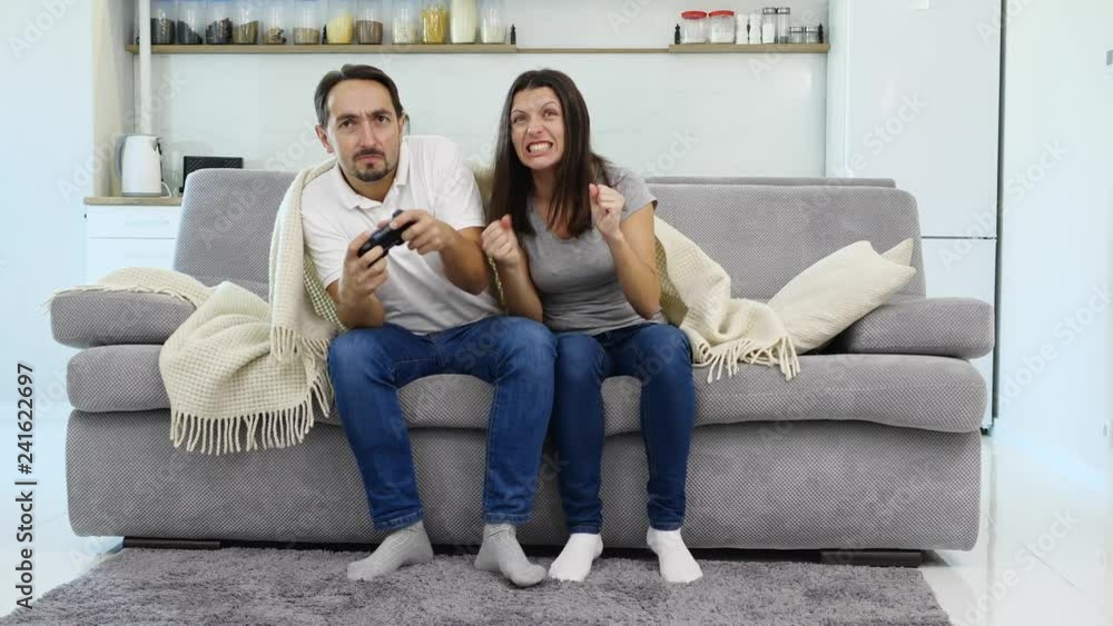 A man plays in a jaostic while a wife watches the process A man plays in a jaostic while a wife watches the process