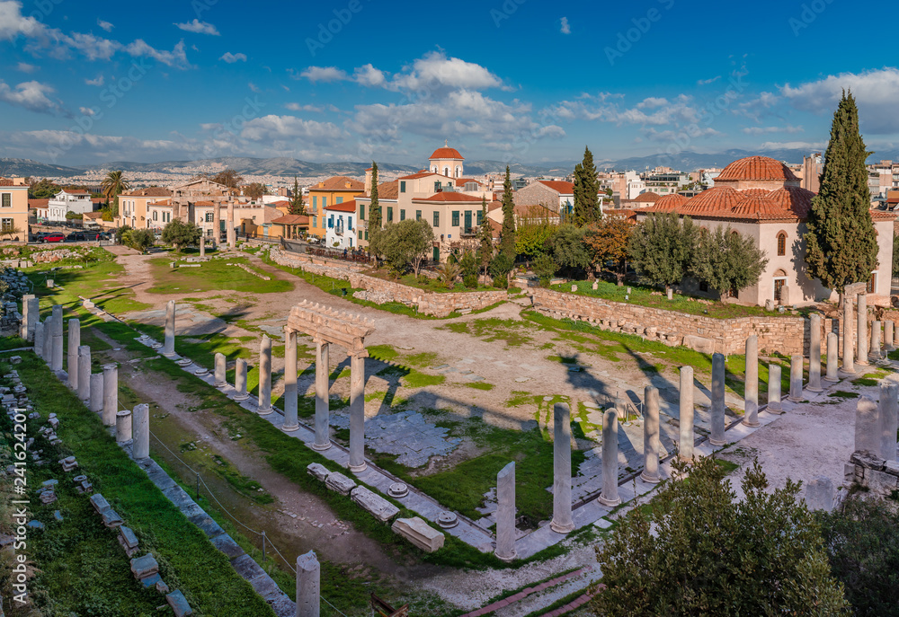 View of the Roman Agora in Athens, built during the Roman period, with the Fethiye Mosque on the right and neoclassical buildings in the background. Athens, Greece, December 2018.
