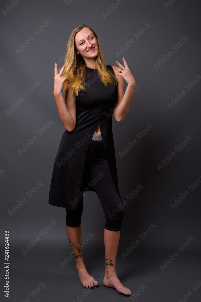 Full length portrait of young beautiful woman standing Full length portrait of young beautiful woman standing