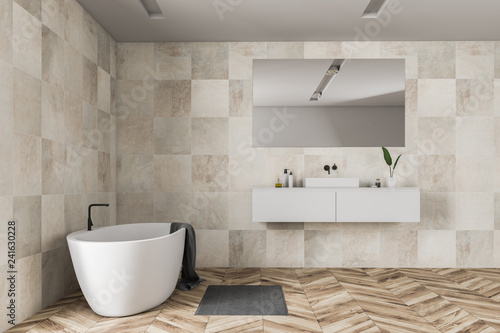 Beige tile bathroom interior  tub and sink