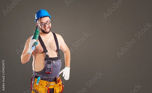 The fat funny man builder with a drill.