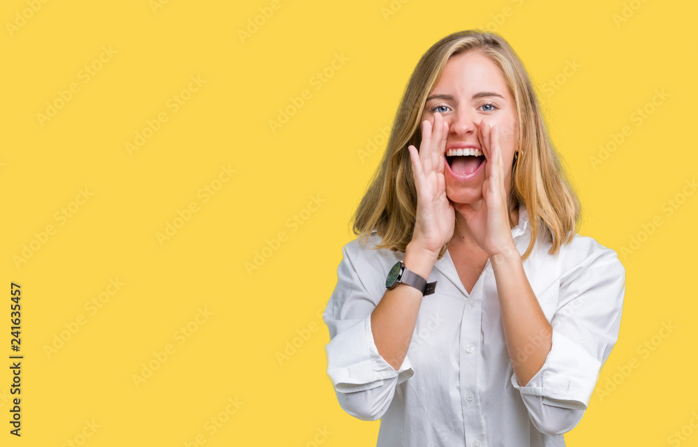 Beautiful young business woman over isolated background Shouting angry out loud with hands over mouth Beautiful young business woman over isolated background Shouting angry out loud with hands over mouth