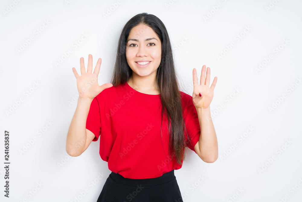 Beautiful brunette woman wearing red t-shirt over isolated background showing and pointing up with fingers number nine while smiling confident and happy. Beautiful brunette woman wearing red t-shirt over isolated background showing and pointing up with fingers number nine while smiling confident and happy.