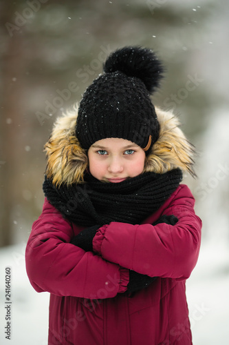Little girl portrait in snow winter.